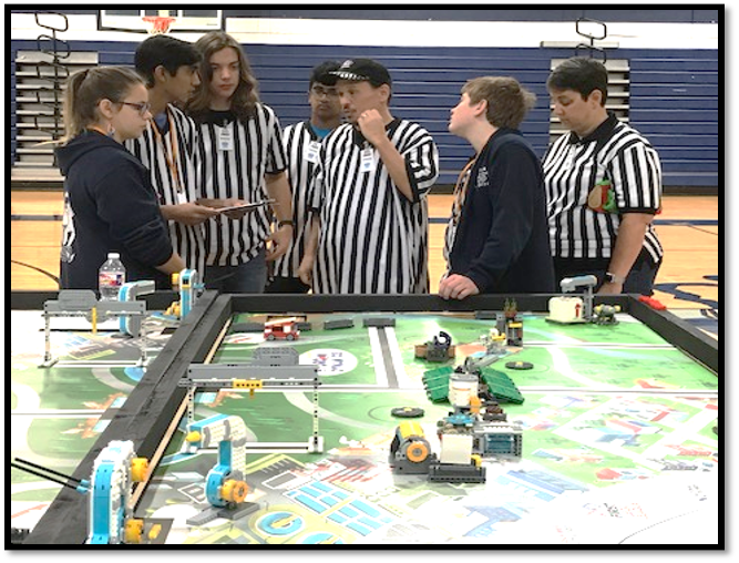 Volunteers at robotics competitions 