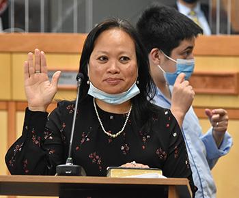 Trustee Angela Powell hand on Bible