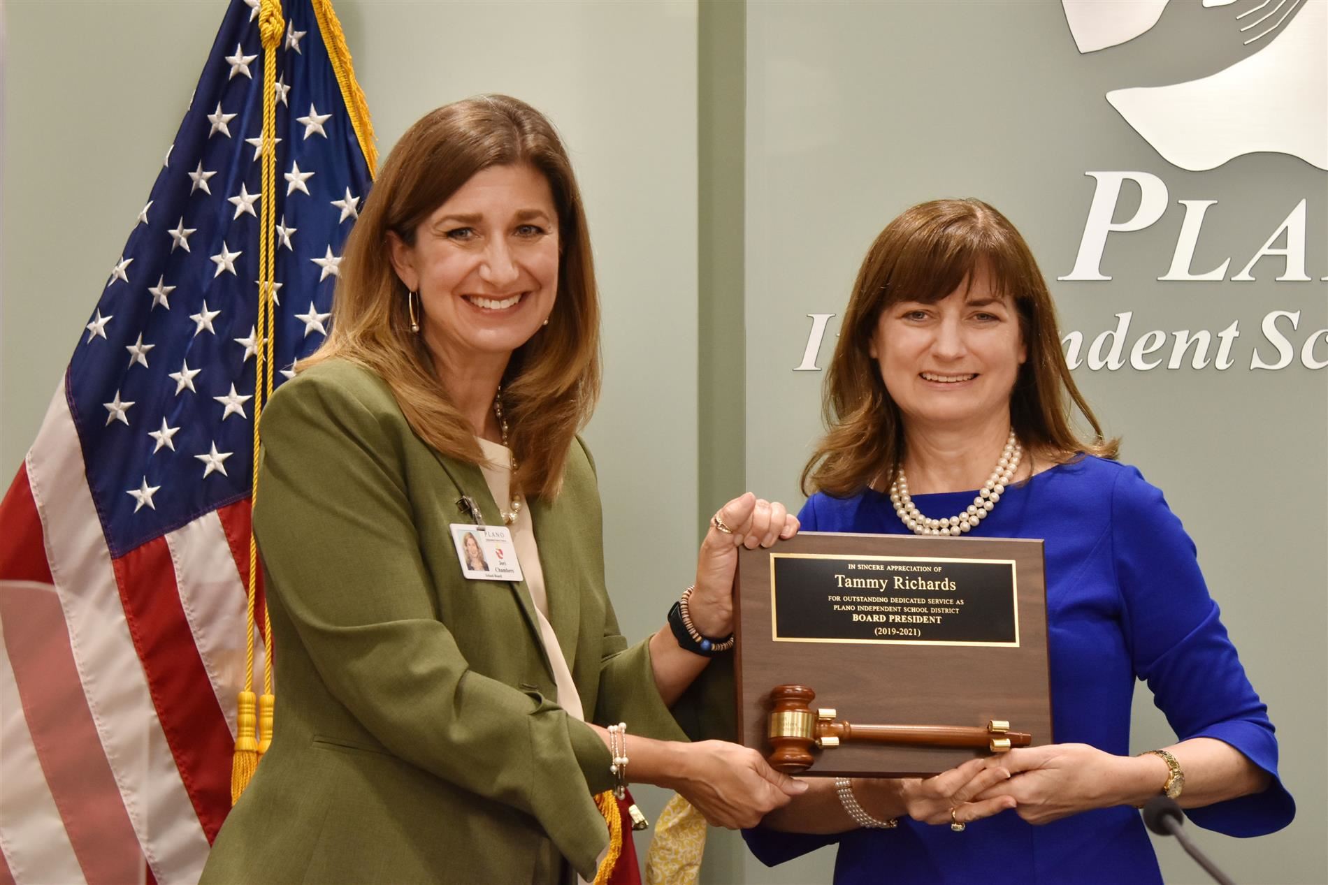 Retiring Board President Tammy Richard receives a plaque and gavel during her recognition