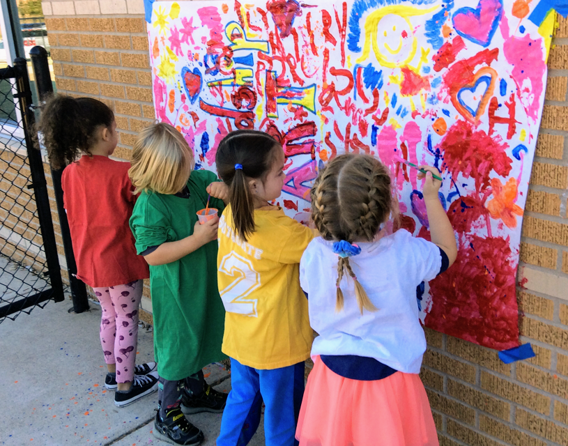children painting outside