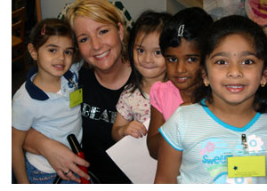Teacher posing with students 