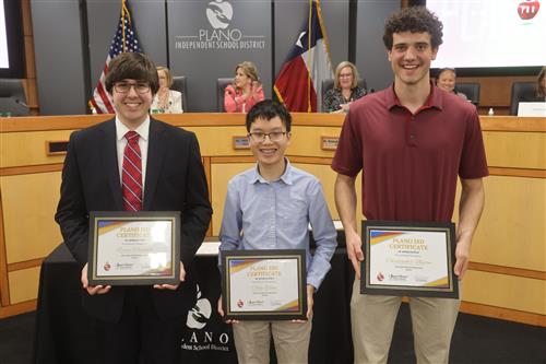 3 individuals holding recognition certificates