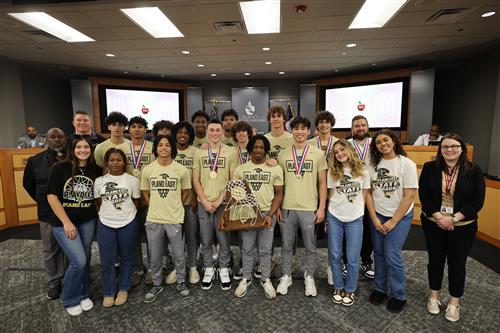Plano East Basketball Team with Vice President Dr. Lauren Tyra