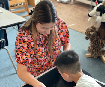  teacher working with student