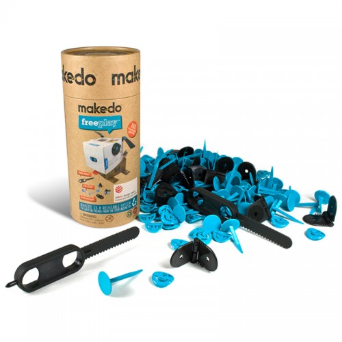 Cardboard canister with blue and white parts laying outside of it 