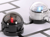 Black and clear Ozobot robots in a maze 