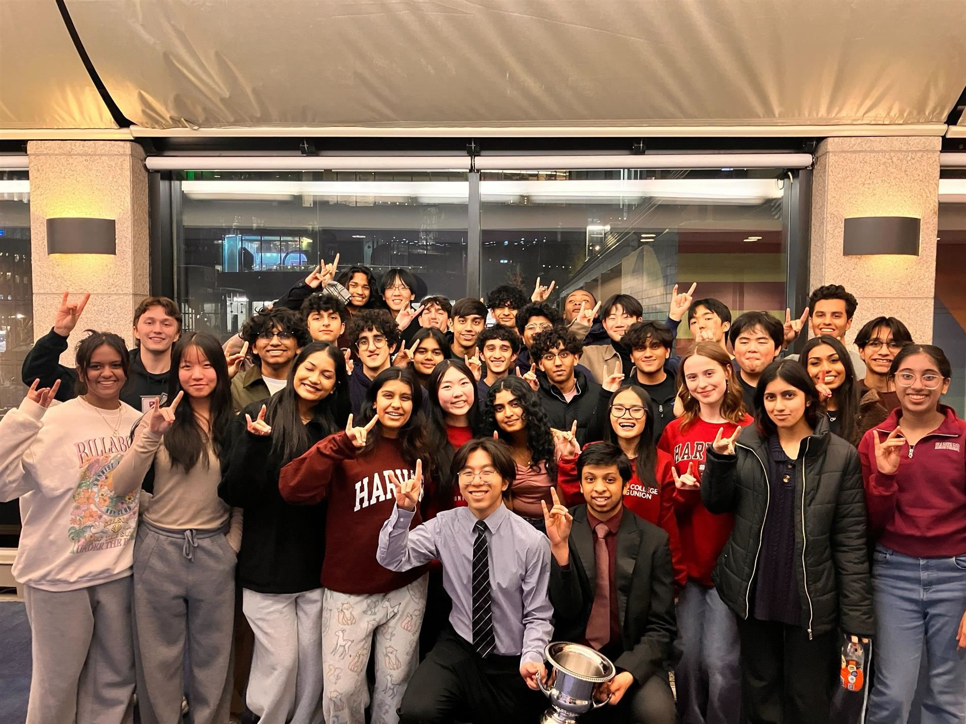 Image of Plano West Speech & Debate TEam with their trophy.