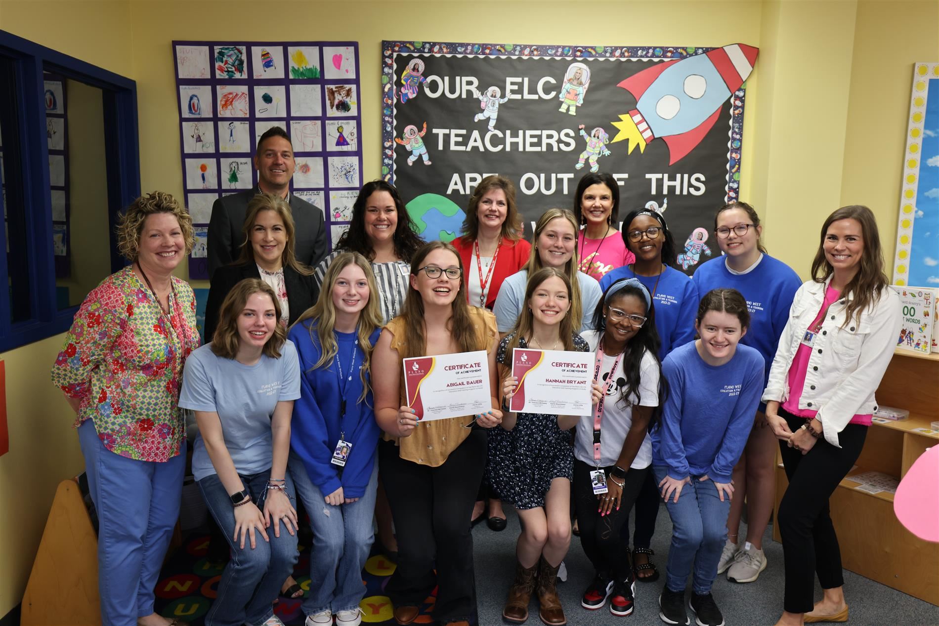  students from plano west with certificates and district administrators